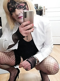 Lucy, a transgender woman with a large penis, showcases her dominatrix fashion in a shiny dress - A collection of 18 images on xHamster