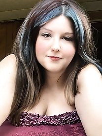 Pretty transsexual woman exposes her breasts.